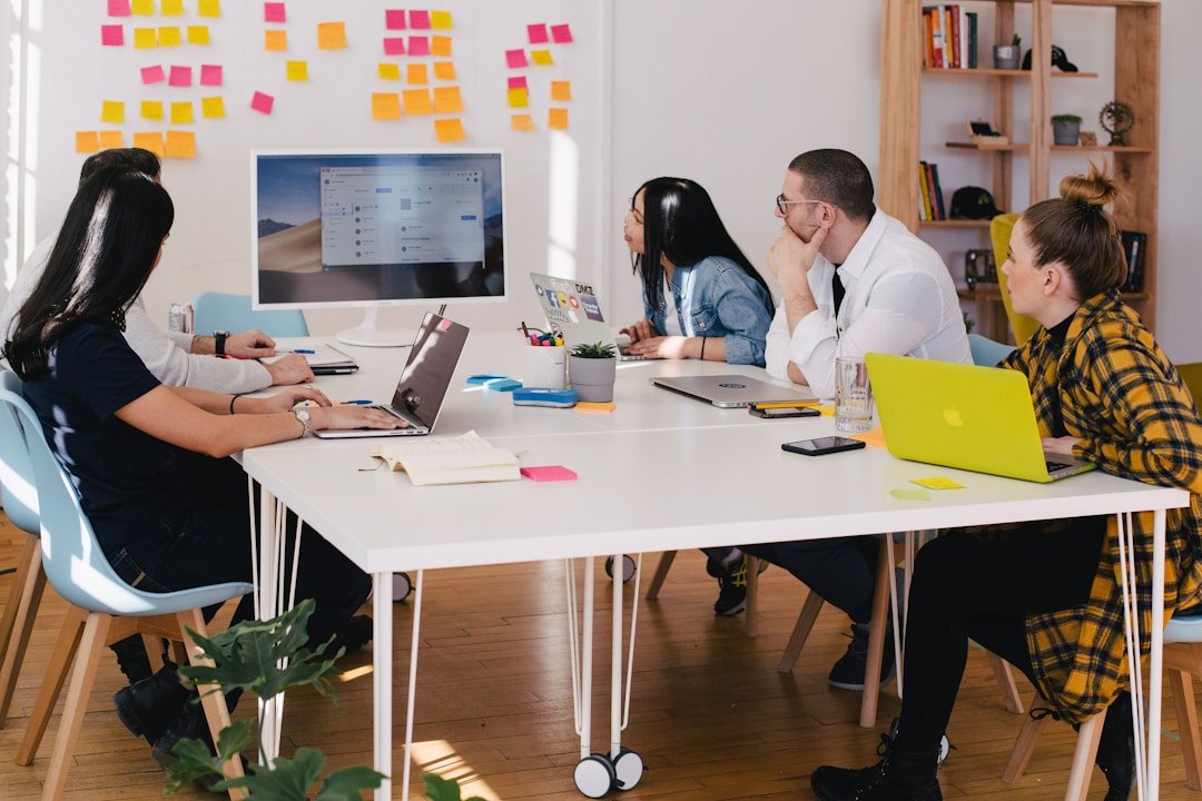 A team in an office discussing customer journey orchestration during a meeting